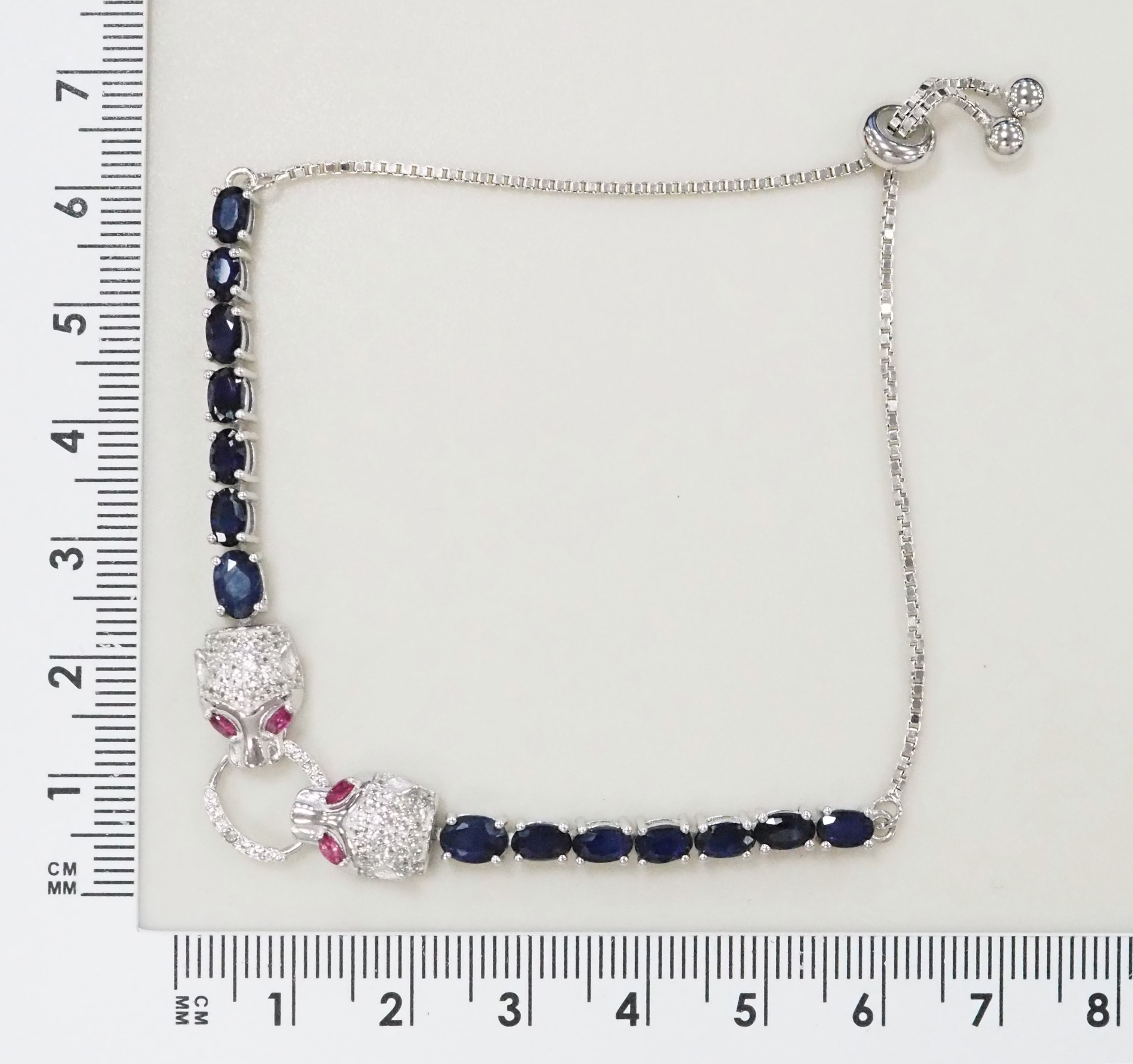 Серебряный браслет 925 пробы; вставки 14 Сапфир 4,83ct F/2; 4 Рубин 0,2ct F/2; Россыпь Топаз белый 0,8ct;